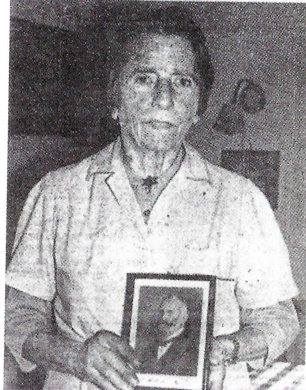Dora Schwarz holding a photo of her mentor Dr Bircher-benner